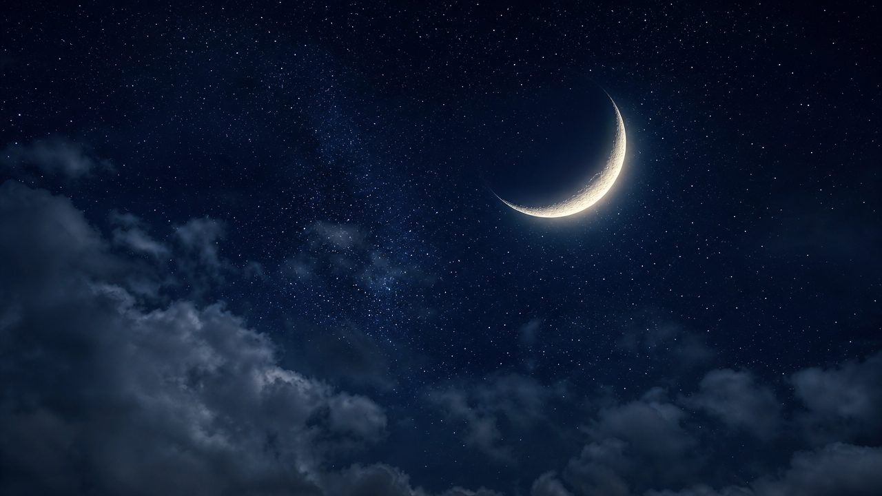 A crescent moon in a starry sky